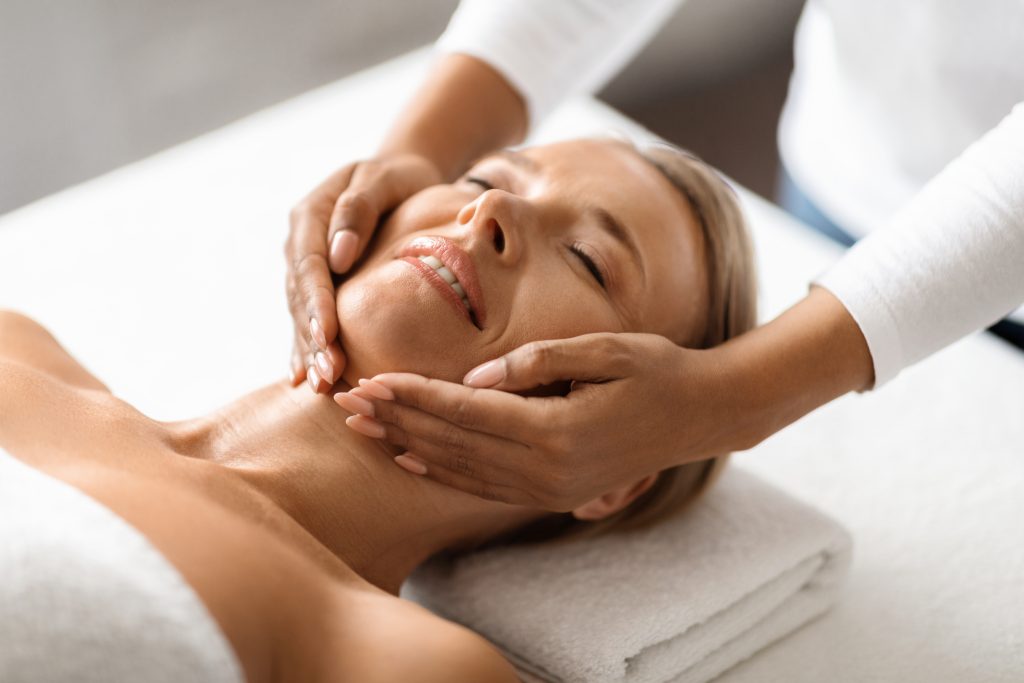 middle aged women having face massage