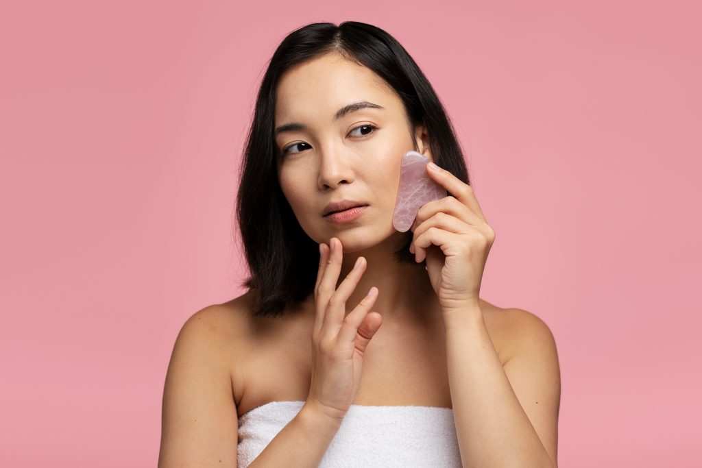 Beautiful asian lady with beauty Gua Sha