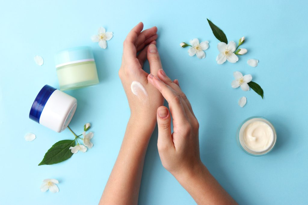 female hands and cosmetic cream