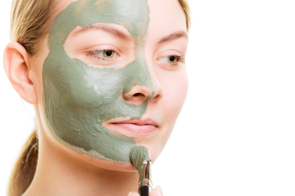 women applying face pack