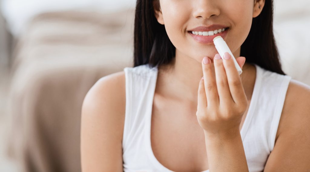 women using lip balm